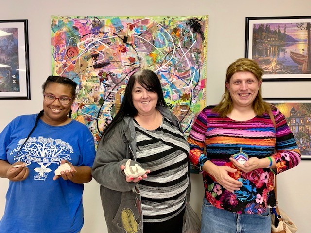 PSR clients with art therapy clay sculptures